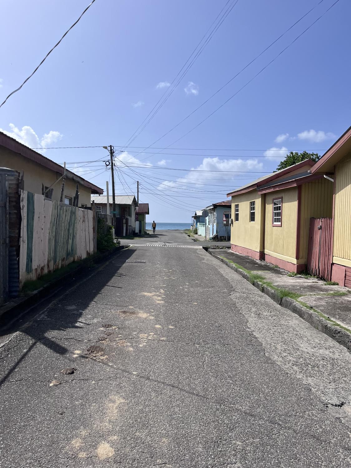 A quiet village road running down to the sea